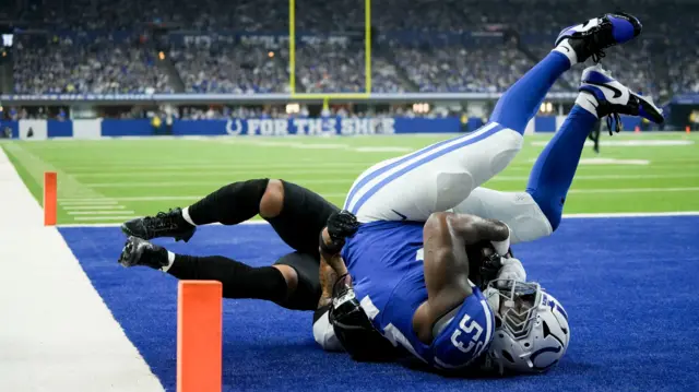 Indianapolis Colts linebacker Germaine Pratt intercepts a pass in front of Jacksonville Jaguars wide receiver Parker Washington