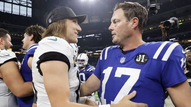 Trevor Lawrence with Philip Rivers after the Jacksonville Jaguars beat the Indianapolis Colts