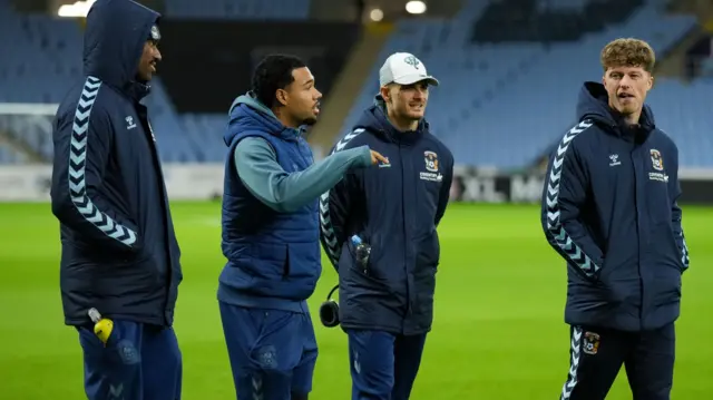 Coventry players, wearing training gear, chat at the CBS Arena