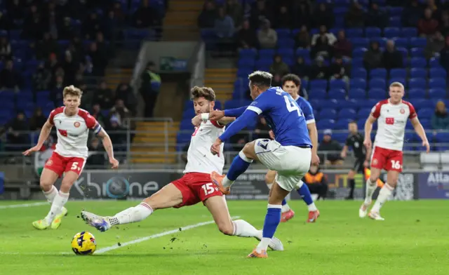 Callum Robinson of Cardiff City has a shot blocked
