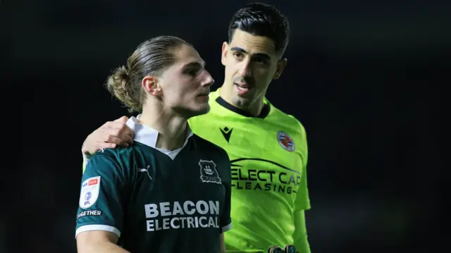 Lorent Tolaj is comforted after his penalty miss against Reading