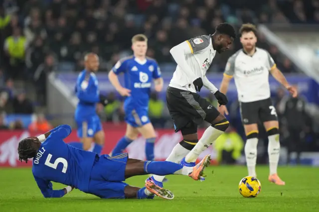 Derby County's Patrick Agyemangr (right) and Leicester City's Caleb Okoli battle for the ball