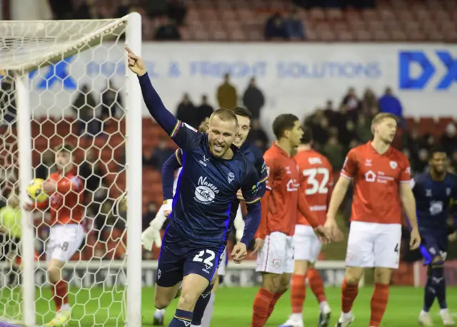 Tom Hamer of Lincoln City celebrates scoring the opening goal
