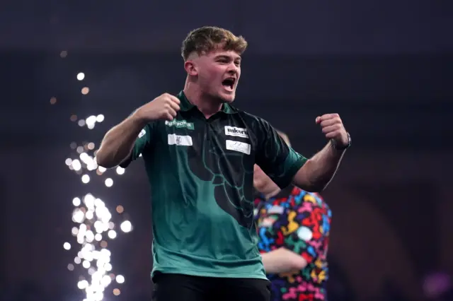 England's Charlie Manby celebrates defeating England's Ricky Evans on day sixteen of the Paddy Power World Darts Championship at the Alexandra Palace, London