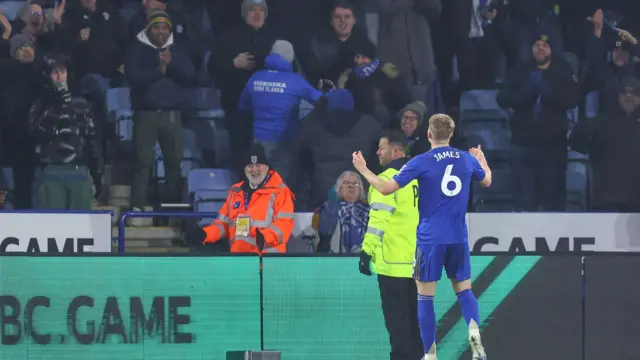 Leicester goalscorer Jordan James celebrates in front of fans
