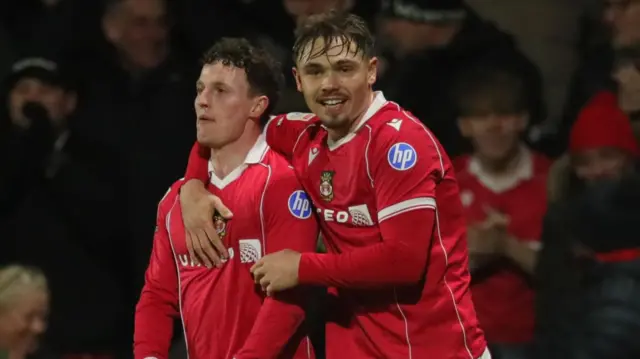 Wrexham's Nathan Broadhead and Callum Doyle celebrate