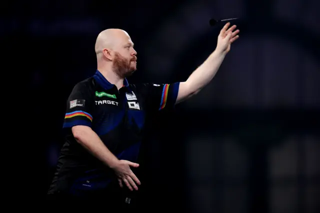 England's Justin Hood during his match against England's Ryan Meikle on day sixteen of the Paddy Power World Darts Championship at the Alexandra Palace, London