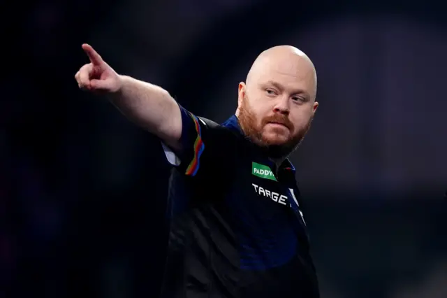 England's Justin Hood reacts during his match against England's Ryan Meikle on day sixteen of the Paddy Power World Darts Championship at the Alexandra Palace, London