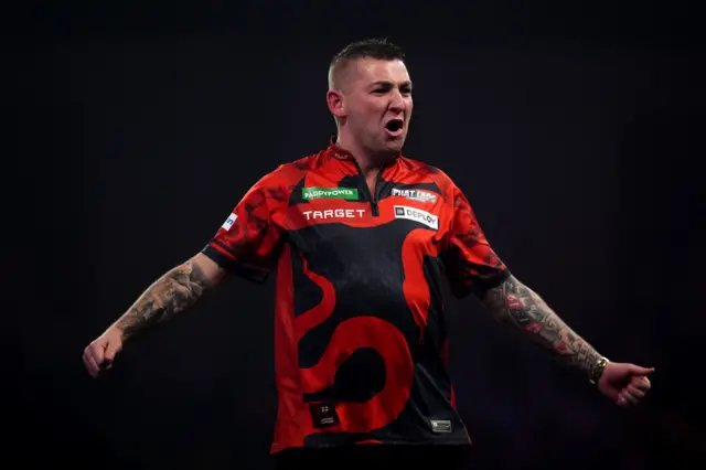 Nathan Aspinall celebrates taking out 170