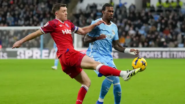 Ipswich's Dara O'Shea clears under pressure from Coventry's Haji Wright