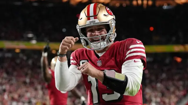 Brock Purdy celebrates after scoring a touchdown for the San Francisco 49ers against the Chicago Bears