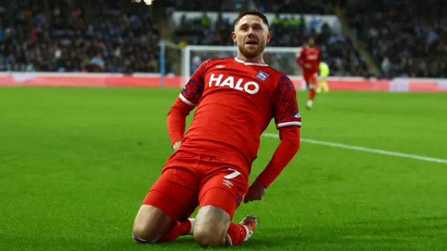 Wes Burns slides on his knees in celebration