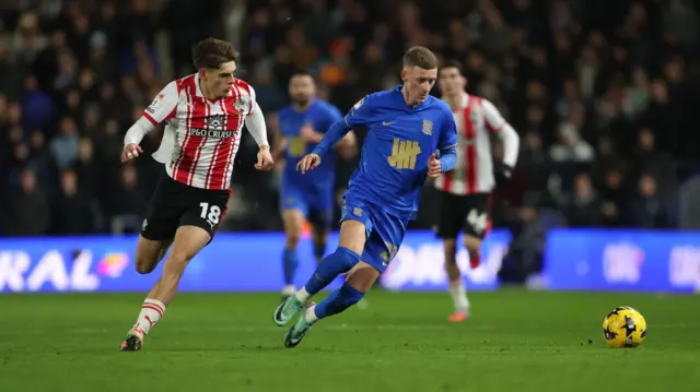 Jay Stansfield dribbles away from Southampton's Tom Fellows