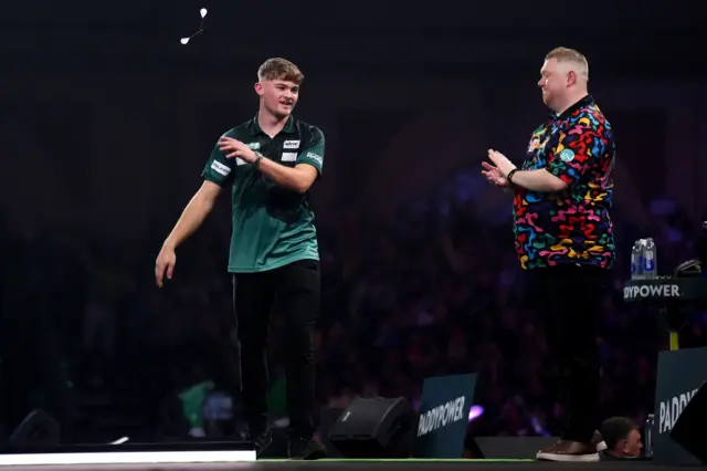 England's Charlie Manby (left) celebrates defeating England's Ricky Evans on day sixteen of the Paddy Power World Darts Championship at the Alexandra Palace, London