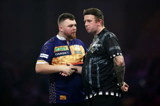 Josh Rock and Callan Rydz shake hands