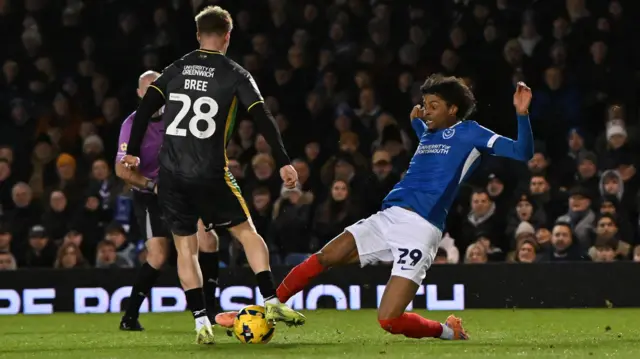 Portsmouth's Harvey Blair tackles James Bree of Charlton