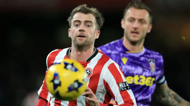 Stoke's Ben Wilmot tries to close down Sheffield United striker Patrick Bamford