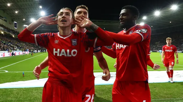 Ipswich goalscorer Jack Clarke cups his ear in celebration
