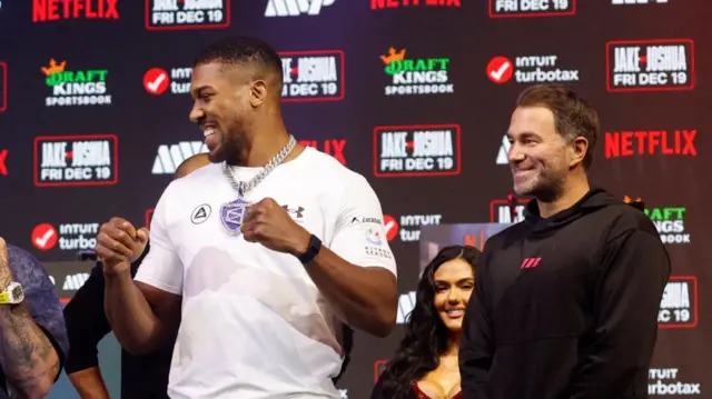 Joshua and Hearn smiling at a pre-match promotion event