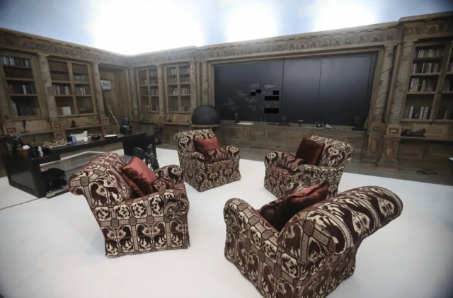 A room in Epstein's home with chairs and chalkboard