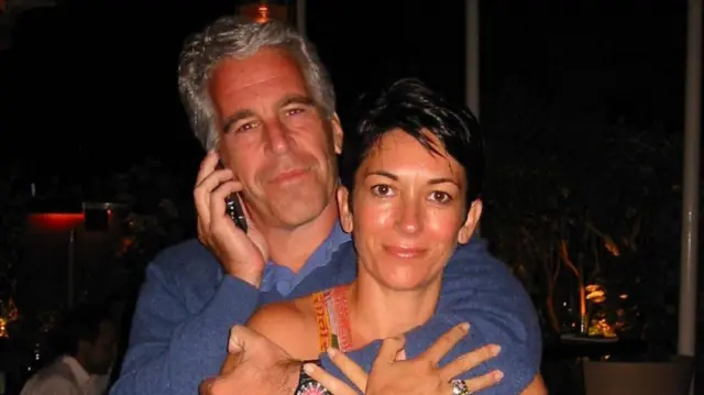 Jeffrey Epstein with his left arm around Ghislaine Maxwell and his right hand holding a phone to his ear.