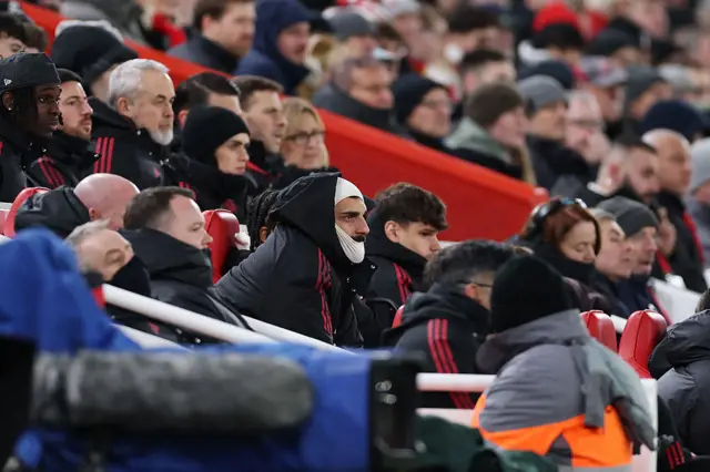 Mohamed Salah watches from the bench