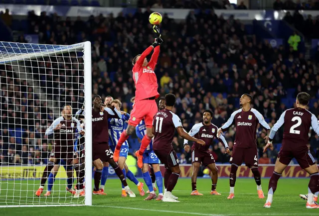 Marco Bizot reaches for a high ball at a corner