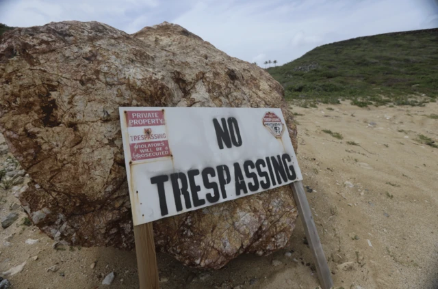 A no trespassing sign on Epstein's property