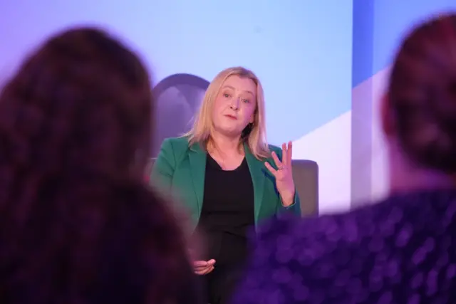 Jane Bryant in a green jacket