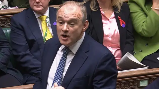 Sir Ed Davey in a blue suit in the commons