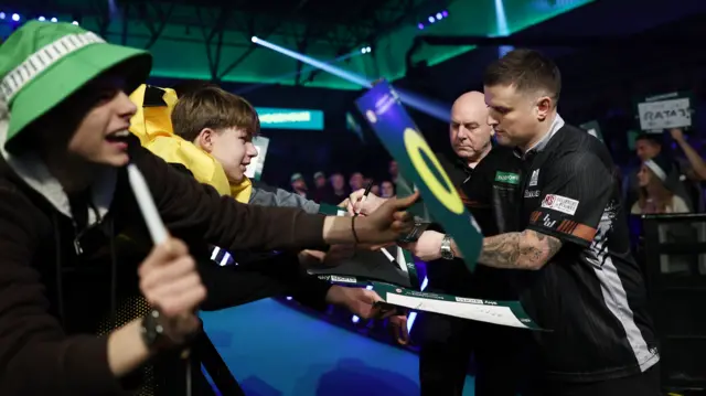 Luke Woodhouse signs autographs