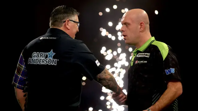 Michael van Gerwen shakes hands with Gary Anderson