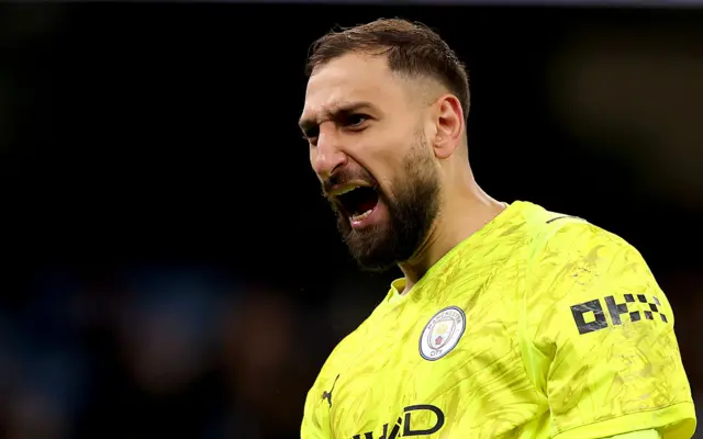 Gianluigi Donnarumma looks on