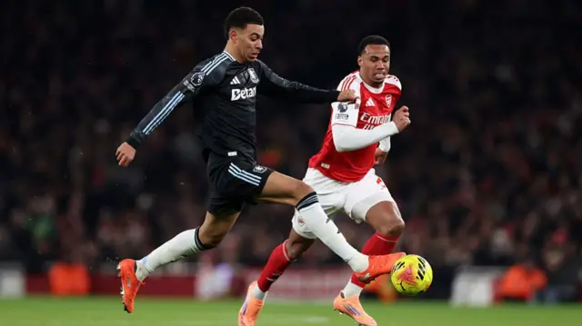 Morgan Rogers of Aston Villa and Gabriel Magalhaes of Arsenal