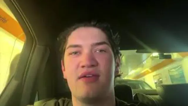 Adam Barras sitting in his family's vehicle