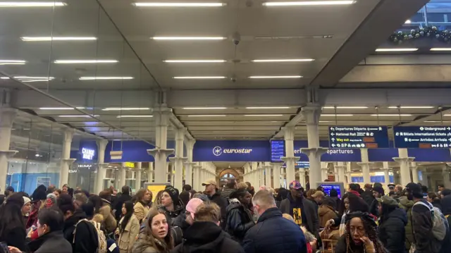 A crowded Eurostar terminal and St Pancras international station