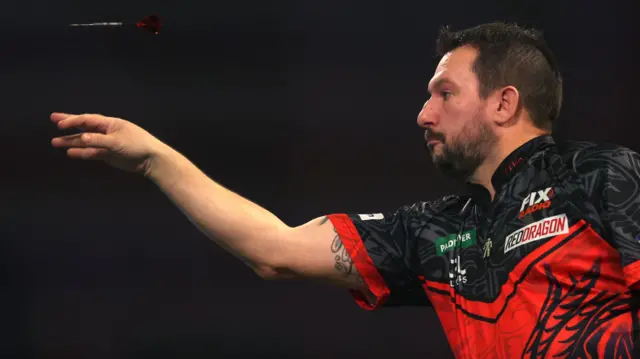 Jonny Clayton throws a dart