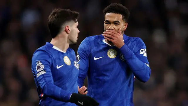 Reece James of Chelsea interacts with teammate Pedro Neto
