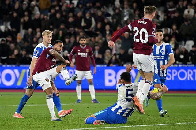 Lewis Dunk commits a handball
