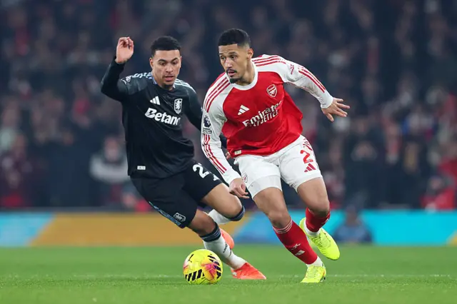 William Saliba of Arsenal runs on the ball