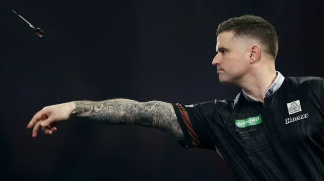 Luke Woodhouse throws a dart