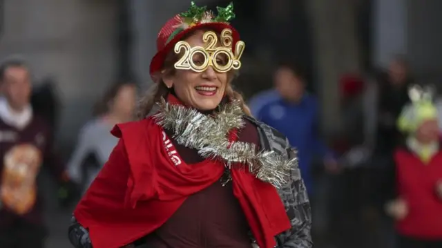 A woman takes part in the San Silvestre Vallecana race in Madrid