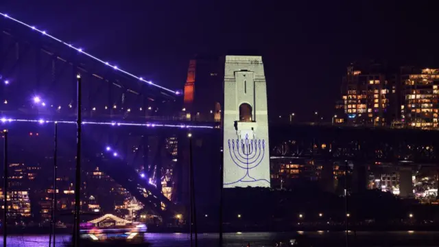 A menorah is projected onto the pylon of the Sydney Harbour Bridge