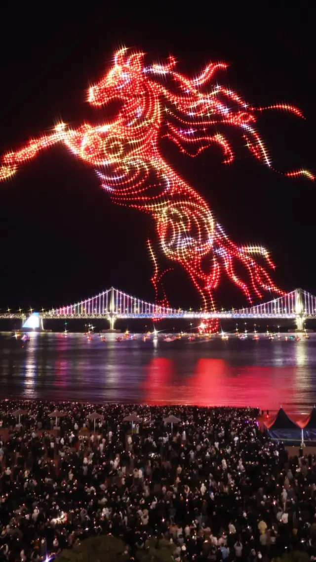 Drones are lit up to create an image of a red horse, South Korea