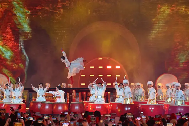 Dancers perform during celebrations of the New Year 2026 at the Juyongguan Great Wall, Beijing.