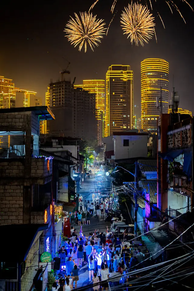 Fireworks explode over skyscrapers during New Year celebrations in Manila, Philippines.