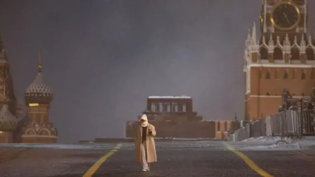 Person walking in a deserted Red Square, Moscow