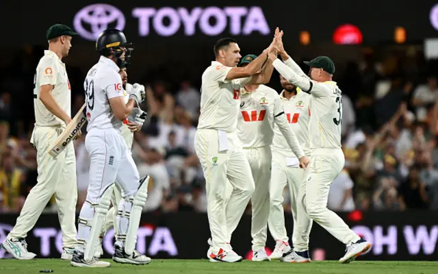 Scott Boland of Australia celebrates with team mates after taking the wicket of Jamie Smith