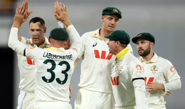 Australia's Scott Boland celebrates with teammates after taking the wicket of England's Jamie Smith
