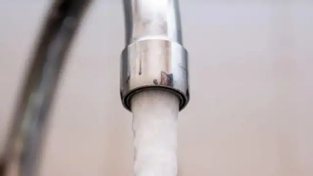 Water flowing from a chrome tap